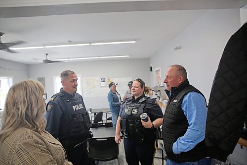 Staff Sgt. Scott McCauley and Cpl. Carrie LeComte speak with RM of Sifton councillor Scott Phillips and MLA Colleen Robbins after the question and answer town hall on Friday. (Connor McDowell/The Brandon Sun)
