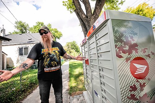 MIKAELA MACKENZIE / FREE PRESS
	
Stephen Giesbrecht with a community mailbox on Andrews Street near Atlantic Avenue on Friday, Aug. 21, 2026.

For Morgan story.
Free Press 2026