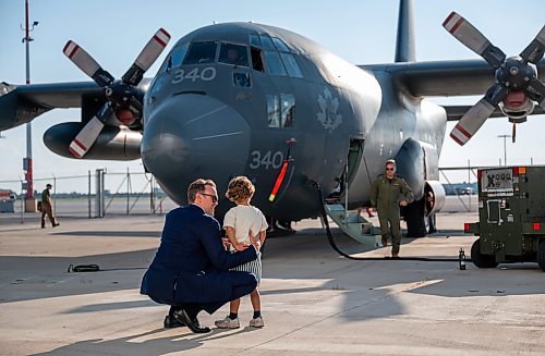 ROBERT LEE / FREE PRESS
People take in the enormous size, significance and stories of the iconic CC-130H Hercules that is standing down from service, marking the end of more than six decades of remarkable service to Canadians at the Royal Aviation Museum in Winnipeg on Friday, August 21, 2026. 