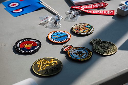 ROBERT LEE / FREE PRESS
Patches celebrating the 435 Squadron are displayed for visitors at the reception for the iconic CC-130H Hercules that is standing down from service, marking the end of more than six decades of remarkable service to Canadians at the Royal Aviation Museum in Winnipeg on Friday, August 21, 2026.