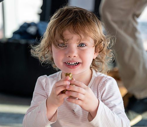 ROBERT LEE / FREE PRESS
Vivienne Verbeek, 2, plays with a figurine of the Burmese lion, known as a chinthe, at the reception for the iconic CC-130H Hercules that is standing down from service at the Royal Aviation Museum in Winnipeg on Friday, August 21, 2026. Vivienne is the daughter of Tim Verbeek, Trainee pilot of the 435 Squadron. 