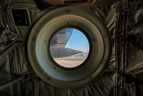 ROBERT LEE / FREE PRESS
Looking through a window of the iconic CC-130H Hercules that is standing down from service at the Royal Aviation Museum in Winnipeg on Friday, August 21, 2026. 