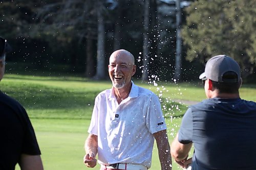 Jason Thorpe's friends shower him with beer after his Tamarack final win at Clear Lake Golf Course on Saturday. (Thomas Friesen/The Brandon Sun)