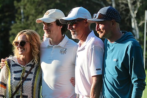 Carrie Thorpe, from left, Ty, Jason and Ryan pose for a family photo after Jason's Tamarack win on Saturday. (Thomas Friesen/The Brandon Sun)