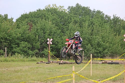 Dunrea's Teagen Reimer rides over an obstacle during the annual Rivers Dirt Rodeo in Pendennis, about 31.5 kilometres northwest of Brandon, on Sunday afternoon. He won first place in the AA class  (Abiola Odutola/The Brandon Sun)