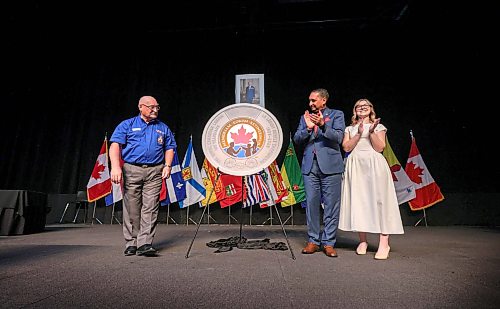 Ruth Bonneville / Free Press
LOCAL STDUP - mint coin
The Royal Canadian Mint unveils a special two dollar coin into circulation in honour of the 100th anniversary of The Royal Canadian Legion with (left to right) Berkley Lawrence, Dominion President, The Royal Canadian Legion
Simon Kamel, Interim President and CEO, Royal Canadian Mint
Vlada Pashchenko, Coin artistat, at the RBC Convention Centre Monday.
The event took place during the Legion’s 50th Dominion Convention in Winnipeg, Manitoba, marking the Legion’s century of support for veterans, their families and communities,
Aug 24th,, 2026