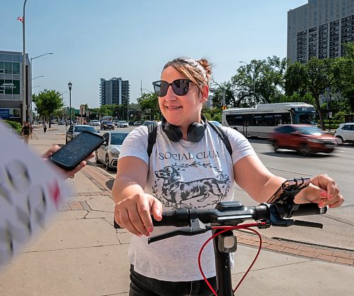 ROBERT LEE / FREE PRESS
Ashley Esquega rides her electric scooter through Winnipeg on Monday, August 24, 2026.
