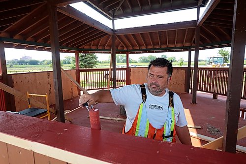 24082026
Chris Maynard, a tradesworker 2 with the City of Brandon, paints the newly repaired gazebo at Dinsdale Park on Monday. According to Maynard approximately 80% of the gazebo was replaced after it was damaged during the flooding earlier in the summer. (Tim Smith/The Brandon Sun)default