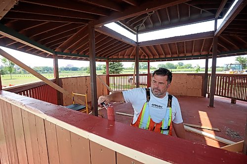 24082026
Chris Maynard, a tradesworker 2 with the City of Brandon, paints the newly repaired gazebo at Dinsdale Park on Monday. According to Maynard approximately 80% of the gazebo was replaced after it was damaged during the flooding earlier in the summer. (Tim Smith/The Brandon Sun)default