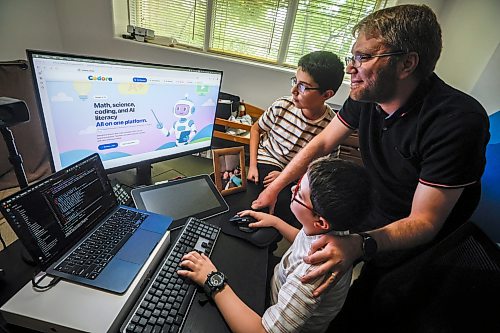 JOHN WOODS / FREE PRESS
Mohamad Alhamoud, CEO of Codora and a software engineer at Amazon, works with his sons, Joud, 9, and Khaled, 11, on his new educational platform, Codora, which provides courses in artificial intelligence, math and coding at their home in Winnipeg Tuesday, August 25, 2026.
reporter: maggie