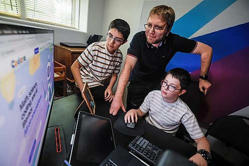 JOHN WOODS / FREE PRESS
Mohamad Alhamoud, CEO of Codora and a software engineer at Amazon, works with his sons, Joud, 9, and Khaled, 11, on his new educational platform, Codora, which provides courses in artificial intelligence, math and coding at their home in Winnipeg Tuesday, August 25, 2026.
reporter: maggie