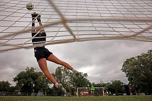 25082026
Goalkeeper Allison Beaumont leaps to block a shot on net as the Brandon University Bobcats women’s soccer team takes part in preseason training at the university on Tuesday morning. The Bobcats start their season on September 12 with their home-opener.  (Tim Smith/The Brandon Sun)