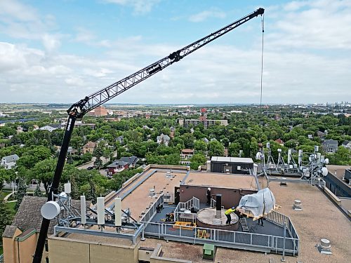 25082026
A crane is used to remove the old observatory dome for the Gulliver Astronomical Observatory from the roof of the McMaster Building at Brandon University and then to install the new dome on Tuesday. The old dome, installed in 1971 was replaced due to age and weathering. The new dome is weather-sealed and fully integrated with the telescope and automated so it can be operated remotely. The telescope was replaced in 2009. The Manitoba government provided $100,000 toward the dome replacement, alongside a $50,000 donation from the family of Brandon University astronomy professor Dr. Austin Gulliver.
(Tim Smith/The Brandon Sun)