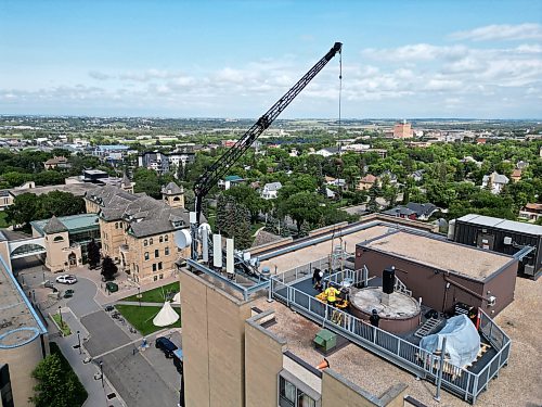 25082026
A crane is used to remove the old observatory dome for the Gulliver Astronomical Observatory from the roof of the McMaster Building at Brandon University and then to install the new dome on Tuesday. The old dome, installed in 1971 was replaced due to age and weathering. The new dome is weather-sealed and fully integrated with the telescope and automated so it can be operated remotely. The telescope was replaced in 2009. The Manitoba government provided $100,000 toward the dome replacement, alongside a $50,000 donation from the family of Brandon University astronomy professor Dr. Austin Gulliver.
(Tim Smith/The Brandon Sun)