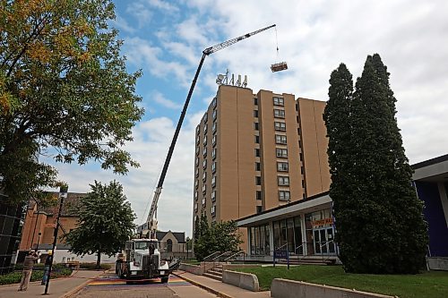 25082026
A crane is used to remove the old observatory dome for the Gulliver Astronomical Observatory from the roof of the McMaster Building at Brandon University and then to install the new dome on Tuesday. The old dome, installed in 1971 was replaced due to age and weathering. The new dome is weather-sealed and fully integrated with the telescope and automated so it can be operated remotely. The telescope was replaced in 2009. The Manitoba government provided $100,000 toward the dome replacement, alongside a $50,000 donation from the family of Brandon University astronomy professor Dr. Austin Gulliver.
(Tim Smith/The Brandon Sun)