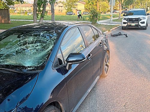 MORGAN MODJESKI / FREE PRESS

Family members on scene say a 13-year-old girl was taken to hospital after she was hit by a sedan at a crosswalk near Jefferson Avenue and Watson Street on Tuesday evening, Aug. 25, 2026. Family members say the child was travelling north on a multi-use trail and was hit by a car travelling westbound on Jefferson Ave. and they were waiting for an update on her condition. Police were on scene, keeping an eye on a badly-damaged scooter and a car with a smashed windshield.