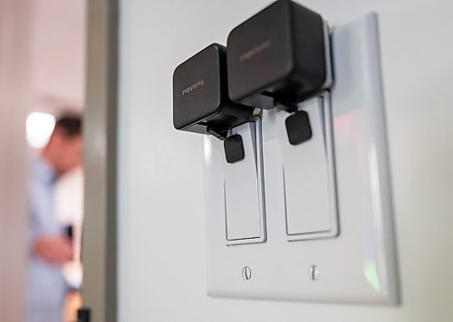 ROBERT LEE / FREE PRESS
Little robots sit atop of light switches that physically turn light switches on and off on command from Google Home as demonstrated at a Smart Suite officially opened today at the Rehabilitation Centre for Children in Winnipeg on Wednesday, August 26, 2026. The Smart Suite helps children with disabilities gain greater independence at home.