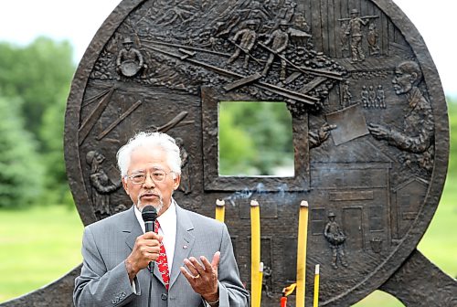 Former MP Inky Mark speaks during the unveiling of the Chinese Head Tax monument at the Brandon Municipal Cemetery in June 2011. (Tim Smith/Brandon Sun)