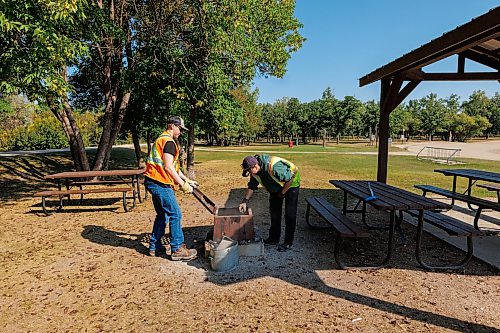 MIKE DEAL / FREE PRESS
Sam Hicock and Zoé Preteau clear out a fire pit as part of the Green Team park maintenance in St. Malo Provincial Park.
Reporter: Melissa Martin
260821 - Friday, August 21, 2026.
