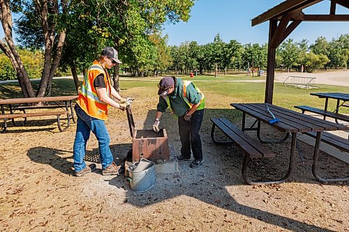 MIKE DEAL / FREE PRESS
Sam Hicock and Zoé Preteau clear out a fire pit as part of the Green Team park maintenance in St. Malo Provincial Park.
Reporter: Melissa Martin
260821 - Friday, August 21, 2026.