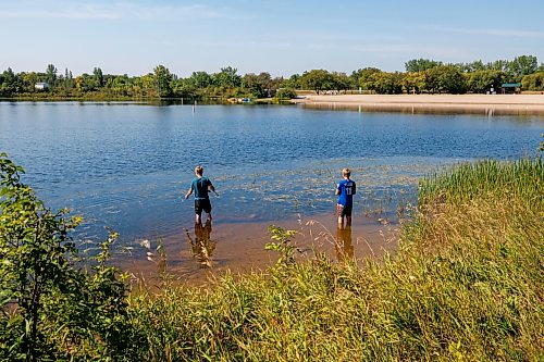 MIKE DEAL / FREE PRESS
Brothers, Cyrus (left), 15, and Jack Funk (right), 13, fish from the shallow water of the lake at St. Malo Provincial Park.
Reporter: Melissa Martin
260821 - Friday, August 21, 2026.