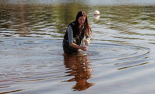 MIKE DEAL / FREE PRESS
Tylo Chadney, acting beach monitoring specialist with the Provinces Environment and Climate Change department, collects water from the lake in St. Malo Provincial Park for monitoring e. coli levels.
Reporter: Melissa Martin
260821 - Friday, August 21, 2026.