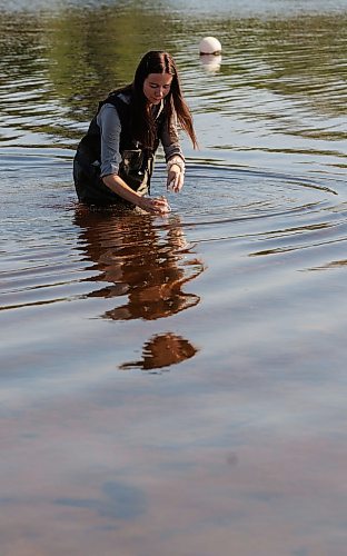 MIKE DEAL / FREE PRESS
Tylo Chadney, acting beach monitoring specialist with the Provinces Environment and Climate Change department, collects water from the lake in St. Malo Provincial Park for monitoring e. coli levels.
Reporter: Melissa Martin
260821 - Friday, August 21, 2026.