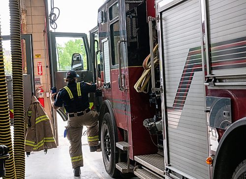 ROBERT LEE / FREE PRESS
A firefighter prepares to depart for a call from Winnipeg Fire Paramedic Service Station 1 on Wednesday, August 19, 2026. Personnel are expected to be en route to the scene within 60 seconds of the notification.  