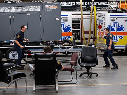 ROBERT LEE / FREE PRESS
Firefighters play a light game of ping pong between calls at Winnipeg Fire Paramedic Service Station 1 on Wednesday, August 19, 2026.