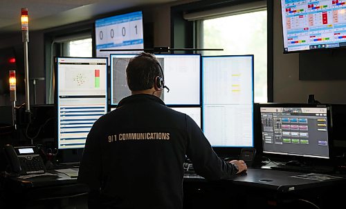 ROBERT LEE / FREE PRESS
A communication operator dispatcher scans his many computer screens at the 911 Communications Centre on Wednesday, August 19, 2026. The screens and corded headset are strong visual cues in the communications centre.