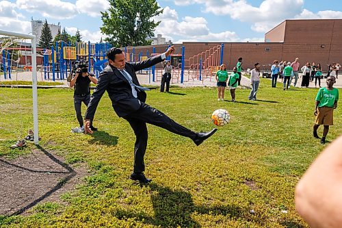MIKE DEAL / FREE PRESS
Premier Wab Kinew plays a little bit of soccer with the kids from the BGC (Boys and Girls Club) of Winnipeg after the announcement.
Premier Wab Kinew and Education and Early Childhood Learning Minister Tracy Schmidt announces that the government is introducing a pilot program for a new health and physical education curriculum that includes an a policy making in-person physical education mandatory for all students from kindergarten to Grade 12.
The press conference held on the playground of Victor Mager School, included other stake holders who spoke; Dr. Brent Roussin, chief provincial public health officer, Jason Cline, superintendent, Rolling River School Division, Alyson Gysel, co-president, Physical Health Educators of Manitoba, and Noelle Depape, president and CEO, Boys and Girls Club Winnipeg.
Reporter: Maggie Macintosh
260827 - Thursday, August 27, 2026.