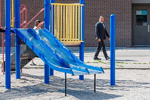 MIKE DEAL / FREE PRESS
Premier Wab Kinew arrives for the press conference walking past a playground at Victor Mager School.
Premier Wab Kinew and Education and Early Childhood Learning Minister Tracy Schmidt announces that the government is introducing a pilot program for a new health and physical education curriculum that includes an a policy making in-person physical education mandatory for all students from kindergarten to Grade 12.
The press conference held on the playground of Victor Mager School, included other stake holders who spoke; Dr. Brent Roussin, chief provincial public health officer, Jason Cline, superintendent, Rolling River School Division, Alyson Gysel, co-president, Physical Health Educators of Manitoba, and Noelle Depape, president and CEO, Boys and Girls Club Winnipeg.
Reporter: Maggie Macintosh
260827 - Thursday, August 27, 2026.