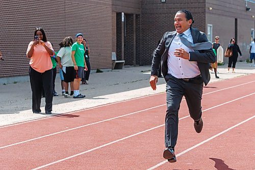 MIKE DEAL / FREE PRESS
Premier Wab Kinew runs a race with the kids from the BGC (Boys and Girls Club) of Winnipeg after the announcement.
Premier Wab Kinew and Education and Early Childhood Learning Minister Tracy Schmidt announces that the government is introducing a pilot program for a new health and physical education curriculum that includes an a policy making in-person physical education mandatory for all students from kindergarten to Grade 12.
The press conference held on the playground of Victor Mager School, included other stake holders who spoke; Dr. Brent Roussin, chief provincial public health officer, Jason Cline, superintendent, Rolling River School Division, Alyson Gysel, co-president, Physical Health Educators of Manitoba, and Noelle Depape, president and CEO, Boys and Girls Club Winnipeg.
Reporter: Maggie Macintosh
260827 - Thursday, August 27, 2026.