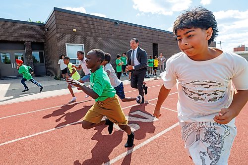 MIKE DEAL / FREE PRESS
Premier Wab Kinew runs a race with the kids from the BGC (Boys and Girls Club) of Winnipeg after the announcement.
Premier Wab Kinew and Education and Early Childhood Learning Minister Tracy Schmidt announces that the government is introducing a pilot program for a new health and physical education curriculum that includes an a policy making in-person physical education mandatory for all students from kindergarten to Grade 12.
The press conference held on the playground of Victor Mager School, included other stake holders who spoke; Dr. Brent Roussin, chief provincial public health officer, Jason Cline, superintendent, Rolling River School Division, Alyson Gysel, co-president, Physical Health Educators of Manitoba, and Noelle Depape, president and CEO, Boys and Girls Club Winnipeg.
Reporter: Maggie Macintosh
260827 - Thursday, August 27, 2026.