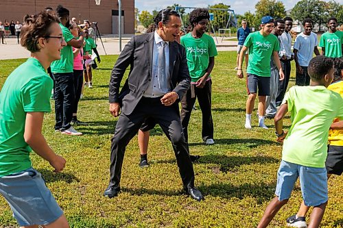 MIKE DEAL / FREE PRESS
Premier Wab Kinew plays a little bit of soccer with the kids from the BGC (Boys and Girls Club) of Winnipeg after the announcement.
Premier Wab Kinew and Education and Early Childhood Learning Minister Tracy Schmidt announces that the government is introducing a pilot program for a new health and physical education curriculum that includes an a policy making in-person physical education mandatory for all students from kindergarten to Grade 12.
The press conference held on the playground of Victor Mager School, included other stake holders who spoke; Dr. Brent Roussin, chief provincial public health officer, Jason Cline, superintendent, Rolling River School Division, Alyson Gysel, co-president, Physical Health Educators of Manitoba, and Noelle Depape, president and CEO, Boys and Girls Club Winnipeg.
Reporter: Maggie Macintosh
260827 - Thursday, August 27, 2026.