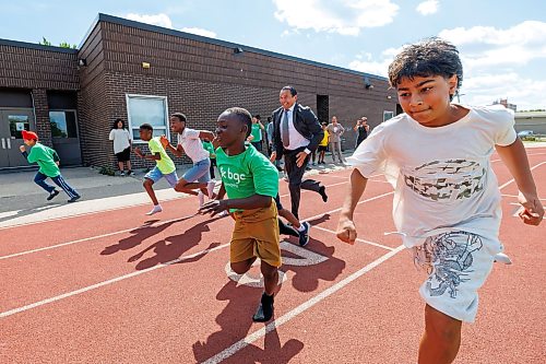 MIKE DEAL / FREE PRESS
Premier Wab Kinew runs a race with the kids from the BGC (Boys and Girls Club) of Winnipeg after the announcement.
Premier Wab Kinew and Education and Early Childhood Learning Minister Tracy Schmidt announces that the government is introducing a pilot program for a new health and physical education curriculum that includes an a policy making in-person physical education mandatory for all students from kindergarten to Grade 12.
The press conference held on the playground of Victor Mager School, included other stake holders who spoke; Dr. Brent Roussin, chief provincial public health officer, Jason Cline, superintendent, Rolling River School Division, Alyson Gysel, co-president, Physical Health Educators of Manitoba, and Noelle Depape, president and CEO, Boys and Girls Club Winnipeg.
Reporter: Maggie Macintosh
260827 - Thursday, August 27, 2026.