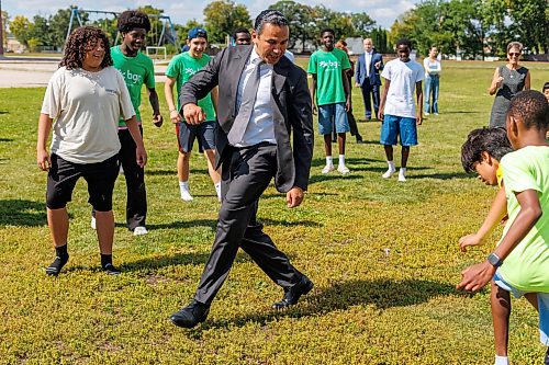 MIKE DEAL / FREE PRESS
Premier Wab Kinew plays a little bit of soccer with the kids from the BGC (Boys and Girls Club) of Winnipeg after the announcement.
Premier Wab Kinew and Education and Early Childhood Learning Minister Tracy Schmidt announces that the government is introducing a pilot program for a new health and physical education curriculum that includes an a policy making in-person physical education mandatory for all students from kindergarten to Grade 12.
The press conference held on the playground of Victor Mager School, included other stake holders who spoke; Dr. Brent Roussin, chief provincial public health officer, Jason Cline, superintendent, Rolling River School Division, Alyson Gysel, co-president, Physical Health Educators of Manitoba, and Noelle Depape, president and CEO, Boys and Girls Club Winnipeg.
Reporter: Maggie Macintosh
260827 - Thursday, August 27, 2026.