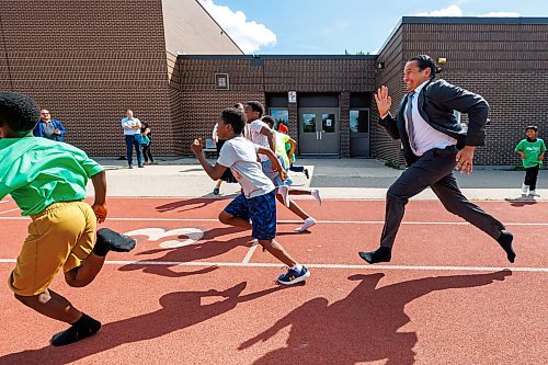 MIKE DEAL / FREE PRESS
Premier Wab Kinew runs a race with the kids from the BGC (Boys and Girls Club) of Winnipeg after the announcement.
Premier Wab Kinew and Education and Early Childhood Learning Minister Tracy Schmidt announces that the government is introducing a pilot program for a new health and physical education curriculum that includes an a policy making in-person physical education mandatory for all students from kindergarten to Grade 12.
The press conference held on the playground of Victor Mager School, included other stake holders who spoke; Dr. Brent Roussin, chief provincial public health officer, Jason Cline, superintendent, Rolling River School Division, Alyson Gysel, co-president, Physical Health Educators of Manitoba, and Noelle Depape, president and CEO, Boys and Girls Club Winnipeg.
Reporter: Maggie Macintosh
260827 - Thursday, August 27, 2026.