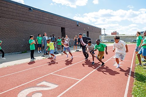MIKE DEAL / FREE PRESS
Premier Wab Kinew runs a race with the kids from the BGC (Boys and Girls Club) of Winnipeg after the announcement.
Premier Wab Kinew and Education and Early Childhood Learning Minister Tracy Schmidt announces that the government is introducing a pilot program for a new health and physical education curriculum that includes an a policy making in-person physical education mandatory for all students from kindergarten to Grade 12.
The press conference held on the playground of Victor Mager School, included other stake holders who spoke; Dr. Brent Roussin, chief provincial public health officer, Jason Cline, superintendent, Rolling River School Division, Alyson Gysel, co-president, Physical Health Educators of Manitoba, and Noelle Depape, president and CEO, Boys and Girls Club Winnipeg.
Reporter: Maggie Macintosh
260827 - Thursday, August 27, 2026.