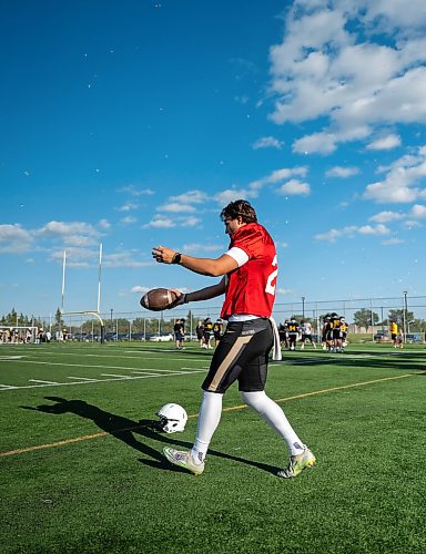 ROBERT LEE / FREE PRESS
Kicker-punter Robert Lasebnik stretches his hamstrings during the University of Winnipeg Bisons practice at Chancellor Matheson in Winnipeg on Thursday, August 27, 2026.