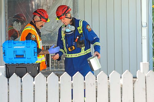 MIKE DEAL / FREE PRESS
WFPS fire investigators dig through debris from a house fire at 344 St. Johns Avenue that has left three injured, one of whom is in critical condition.
260828 - Friday, August 28, 2026
