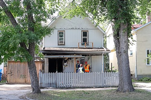 MIKE DEAL / FREE PRESS
WFPS fire investigators dig through debris from a house fire at 344 St. Johns Avenue that has left three injured, one of whom is in critical condition.
260828 - Friday, August 28, 2026