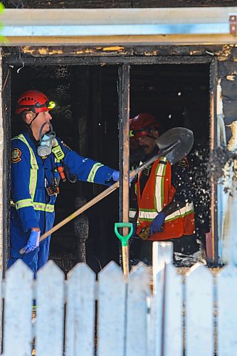 MIKE DEAL / FREE PRESS
WFPS fire investigators dig through debris from a house fire at 344 St. Johns Avenue that has left three injured, one of whom is in critical condition.
260828 - Friday, August 28, 2026