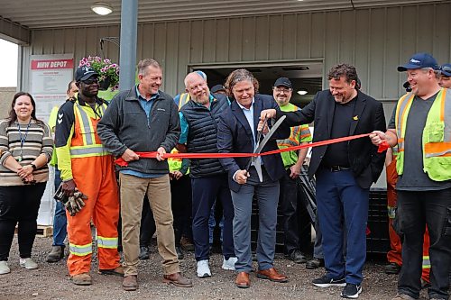 Corey Wagner, solid waste manager for the City of Brandon, Coun. Tyson Tame (Ward 10), Mayor Jeff Fawcett and Brandon East MLA Glen Simard cut a ribbon with other dignitaries during the opening ceremony for the new Eastview Residential Diversion Depot at the Eastview Landfill on Friday. (Tim Smith/The Brandon Sun)
