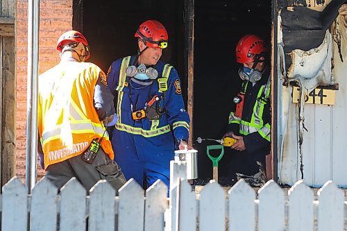 MIKE DEAL / FREE PRESS
WFPS fire investigators dig through debris from a house fire at 344 St. James Avenue that has left three injured, one of whom is in critical condition.
260828 - Friday, August 28, 2026