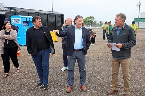 28082026
Corey Wagner (R), Solid Waste Manager for the City of Brandon, gives a tour of the new Eastview Residential Diversion Depot at the Eastview Landfill Site to dignitaries including Brandon East MLA Glen Simard, Councillor Tyson Tame and Brandon Mayor Jeff Fawcett on Friday. 
(Tim Smith/The Brandon sun)
