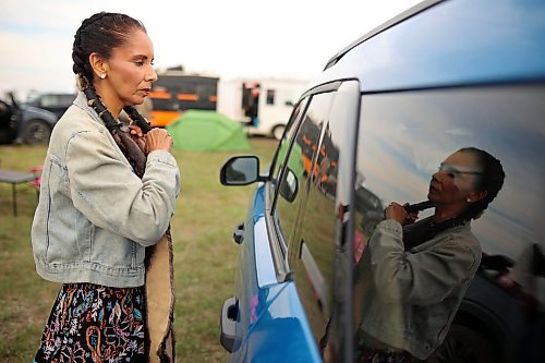 28082026
Women’s jingle dancer Amber Flett of Winnipeg prepares for the grand entry at the opening evening of the Birdtail Sioux Dakota Nation Powwow on Friday. The powwow marked the nation’s first powwow in 15 years and is being held all weekend at Birdtail’s brand new powwow arbor. The event brings in dancers, drummers and spectators from near and far.
(Tim Smith/The Brandon Sun)