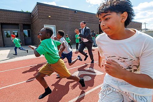 MIKE DEAL / FREE PRESS
Premier Wab Kinew runs a race with the kids from the BGC (Boys and Girls Club) of Winnipeg after the announcement.
Premier Wab Kinew and Education and Early Childhood Learning Minister Tracy Schmidt announces that the government is introducing a pilot program for a new health and physical education curriculum that includes an a policy making in-person physical education mandatory for all students from kindergarten to Grade 12.
The press conference held on the playground of Victor Mager School, included other stake holders who spoke; Dr. Brent Roussin, chief provincial public health officer, Jason Cline, superintendent, Rolling River School Division, Alyson Gysel, co-president, Physical Health Educators of Manitoba, and Noelle Depape, president and CEO, Boys and Girls Club Winnipeg.
Reporter: Maggie Macintosh
260827 - Thursday, August 27, 2026.