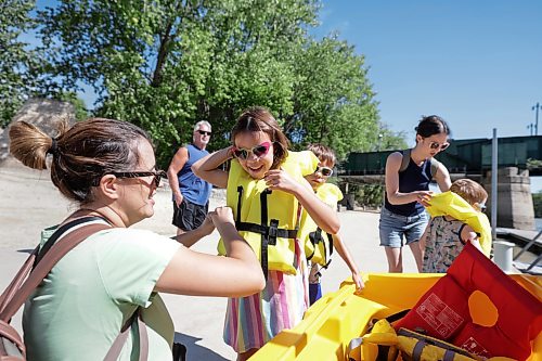 Ruth Bonneville / Free Press

Standup - Forks River Tour 

Six-year-old Amelia Manson has her life jacket buckled up by her mom Colleen Manson as the extended family gets ready to head out on a Winnipeg Waterways tour boat at the Forks docks Monday.  

Amelia’s brother, Max Manson (8yrs) is behind her and their cousin Henry Nimchuck (4yrs() along with other extended members of the family prep for the trip, behind them.  

Winnipeg Waterways offers scenic river boat tours and seasonal water bus transit along the Red and Assiniboine Rivers, departing from The Forks Historic Port. The Water Bus ends Sept 13 but the tour boats will be running until Oct 4th this year. 


Aug 28th,,  2026