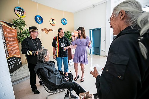 MIKAELA MACKENZIE / FREE PRESS
	
Minister Bernadette Smith (centre, purple dress) chats with Don Robinson (seated), Perry Williams (standing, left) and Parry Francois (standing, centre) at the Native Addictions Council of Manitoba grand re-opening of its renovated space on Salter Street on Tuesday, Sept. 1, 2026.

For Scott story.
Free Press 2026